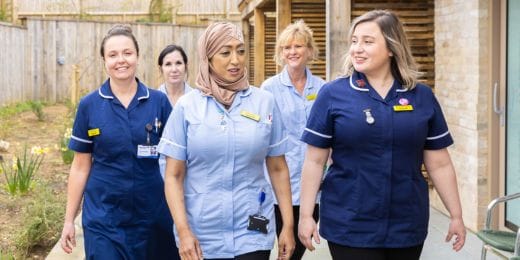 Group of Southern Hospice Group nurses walking together outside the hospice, reflecting teamwork, dedication, and compassionate end-of-life care.